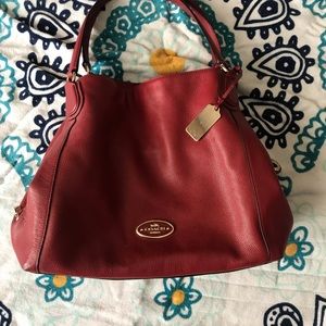 Red leather Coach bag with zipper lock